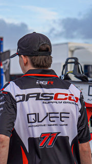 crew guy  wearing a branded racing team shirt.
